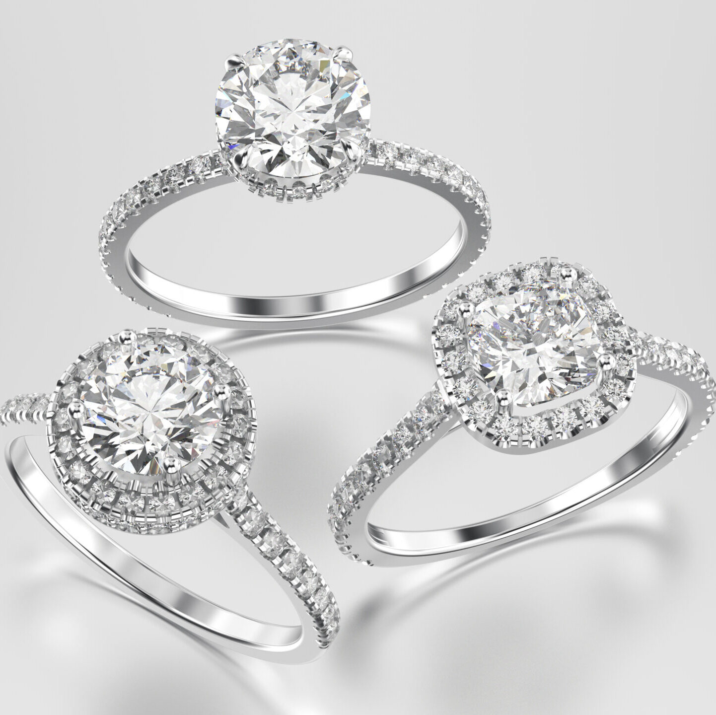 3D illustration three different white gold or silver diamonds rings with reflection